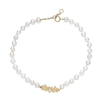 Armband aus runden Perlen, Blumenkranz mit Zirkonia in der Mitte, Karabinerverschluss.