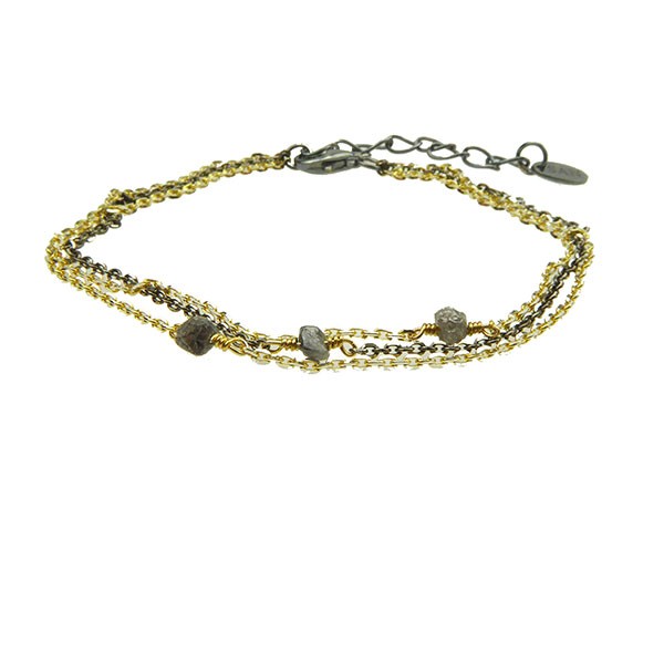 Dreireihiges Armband aus Gold und Schwarz mit rauen, anthrazitfarbenen Steinen und Verlängerungskette.