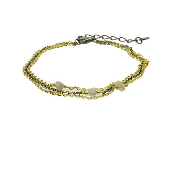 Elegantes Armband, gold/dunkel rhodiniert, mit grauen Rohdiamanten und Verlängerungskette.