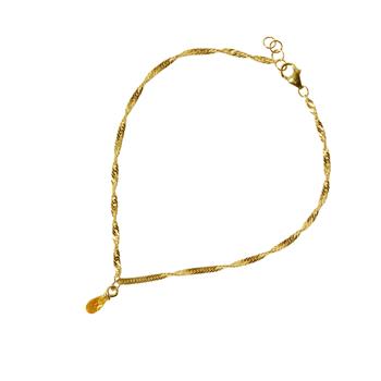 Feines gedrehtes Armband in Goldoptik mit gelb-orangenem Steinanhänger und Verlängerungskette.