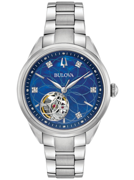 Blaue Uhr mit floralem Zifferblatt, sichtbarem Mechanismus, diamantähnlichen Markierungen, Metallarmband.